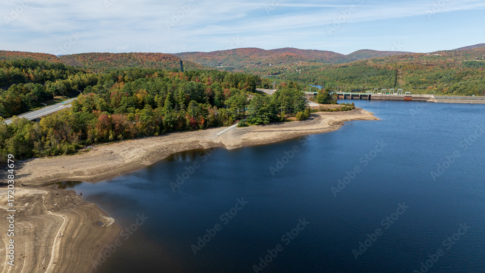 Fototapeta premium Aerial view of Moore Reservoir in Littleton, NH showing exposed shoreline during drought conditions.