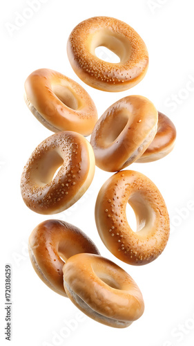 Falling bagels with sesame seeds isolated on transparent background, a delicious and versatile bread for breakfast, lunch, or snack, a bakery staple