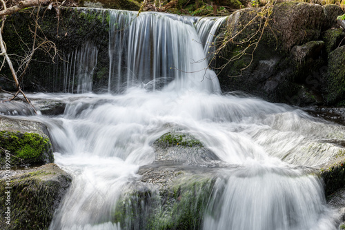Long exposure of a waterfall on the Hoar Oak Water river at Watersmeet in Exmoor National Park