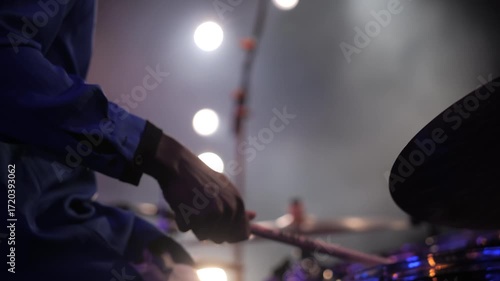 Drummer playing live on stage