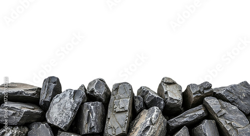 Pile of Dark Grey Rough Rocks Against Black stones