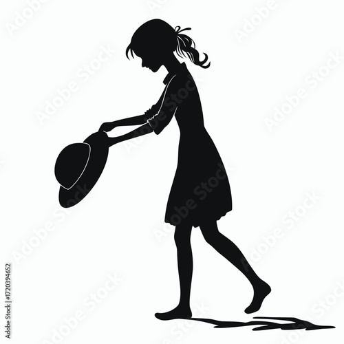 Girl holding sunhat silhouette