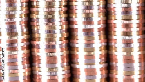 Towering stacks of euro coins, a close-up view of financial abun