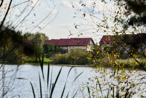 Enjoy a Serene Waterfront View Surrounded by Cozy and Inviting Homes and Natures Beauty