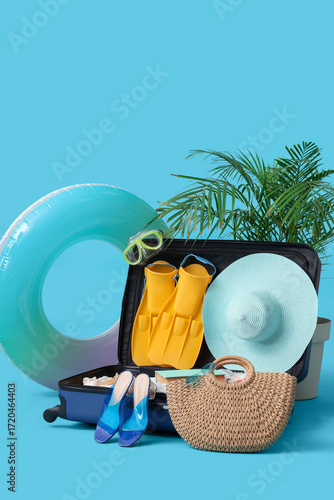 Suitcase with stylish beach...
