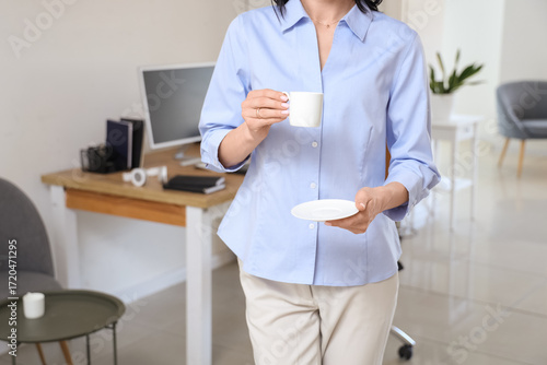 Young woman with cup of cof...