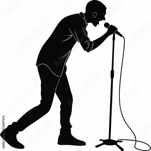 Singer leaning into microphone silhouette