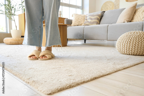 Woman in slippers on soft c...
