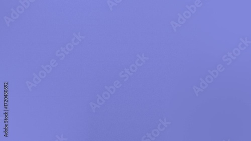 Seamless loop background with a smooth purple gradient. Features a soft, grainy texture transitioning gently from light to dark shades. 4K resolution.
