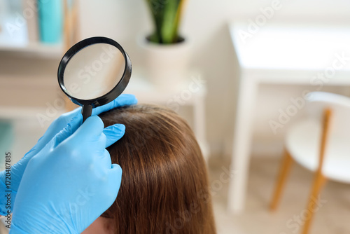 Female doctor with magnifie...
