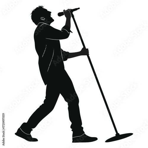 Singer holding microphone stand silhouette