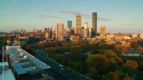 Wallpaper Mural The boston skyline glows at sunset, showcasing its modern architecture Torontodigital.ca