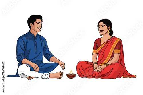 Couple in traditional indian clothing celebrating diwali with a diya lamp light