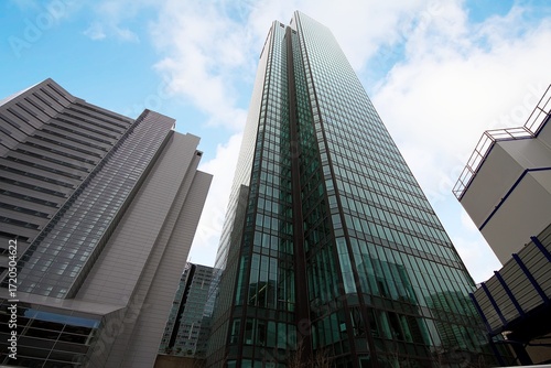Modern skyscrapers and other business buildings with their glass facades in the La Defense district of Paris, France.