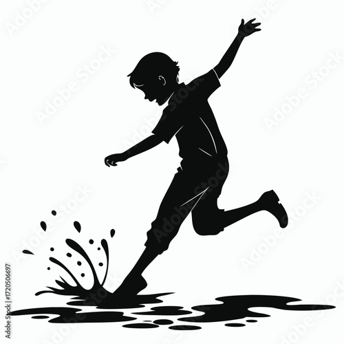 Boy splashing puddle silhouette
