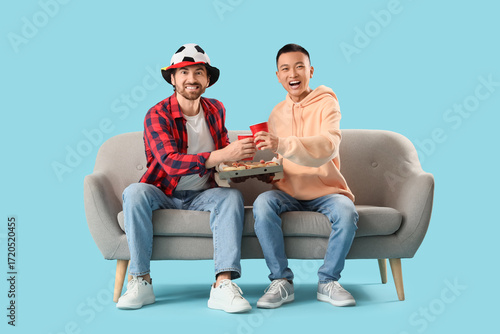 Male sports fans with beer ...