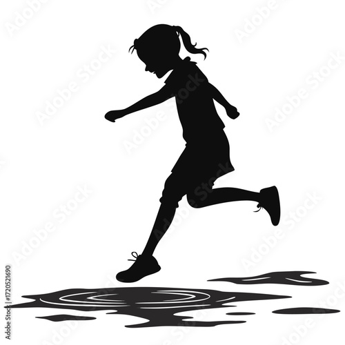 Girl jumping over puddle silhouette