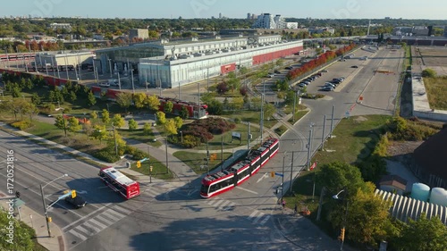 A streetcar pulls out of a maintenance facility to begin service