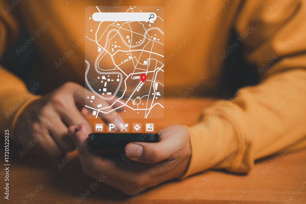 Ταπετσαρία Man using a smartphone with a futuristic digital map interface showing a red location pin, representing online navigation, GPS tracking, digital maps and real-time geolocation technology