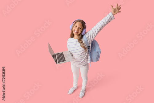 Happy schoolgirl with lapto...