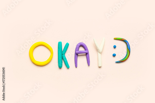 Word OKAY made of play doug...