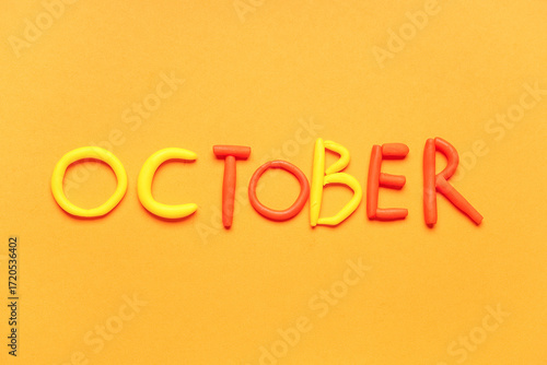 Word OCTOBER made of play d...