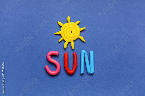Word SUN made of play dough...