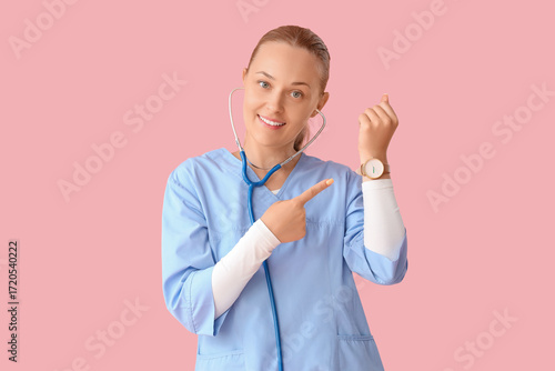Female doctor pointing at w...