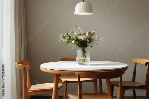 Elevate your design with a stunning vase of wildflowers on a modern round table, perfect for creating a warm, inviting atmosphere in any home or office space