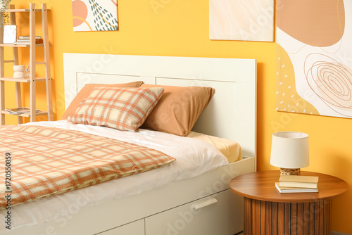 Comfortable bed with beige ...