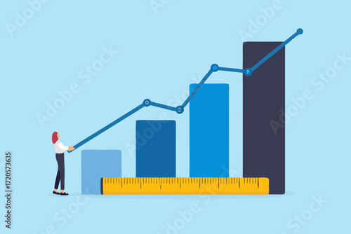Businesswoman measuring and analyzing upward trending bar graph with line chart and ruler