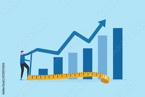 Man measuring financial growth chart with tape measure representing business success and progress