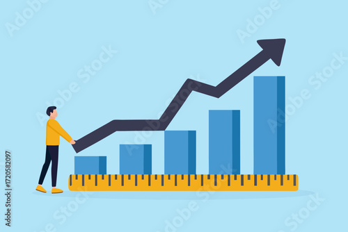 Man standing next to a growth chart with an upward trending arrow and a measuring tape