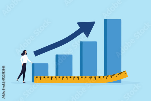 Business growth concept with a woman observing a rising bar chart and an upward trending arrow and a measuring tape