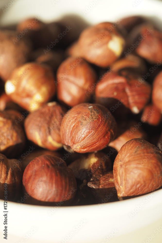 Fototapeta premium Hazelnuts in a bowl ready for cooking and snacking