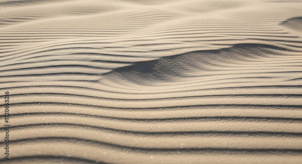 Obraz premium Close-up view of windswept desert sand exhibiting intricate patterns and ripples.