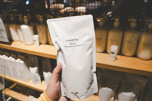 Shampoo Refill in Sustainable Packaging. shampoo refill pouch in a retail store. eco friendly and sustainable product packaging.