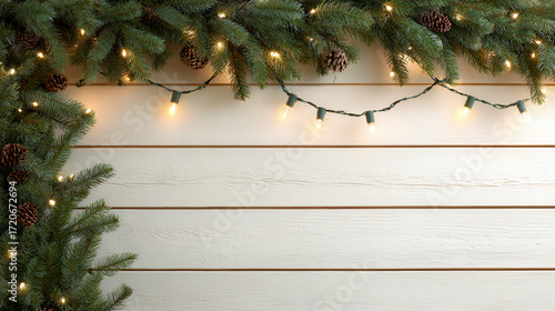 Festive holiday background with pine branches, glowing string lights, and pinecones on a white wooden panel—perfect for Christmas themes.