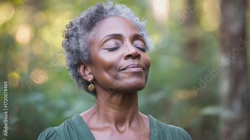 Elderly African-American woman short curly hair standing forest relaxed Mature Black American