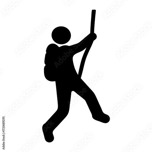 Silhouette of a backpacker using a walking stick for balance and support