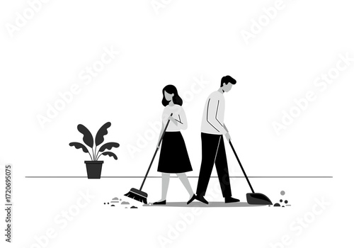 Man and woman cleaning floor with brooms indoors near plant  