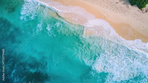 A serene beach scene with turquoise water and white sand, featuring a lone figure in the distance.