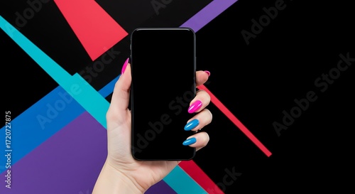 Stylish woman holding phone with blank screen and trendy colorful manicure against abstract background for beauty or technology promotions