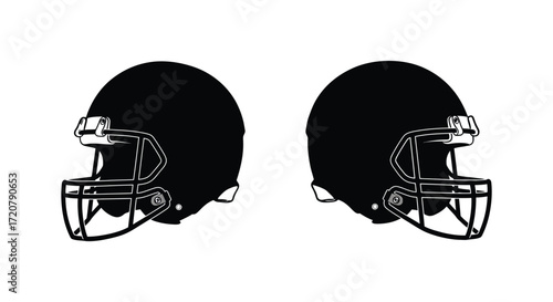 Two black american football helmets facing opposite directions iconic sport gear and athlete protection symbols isolated on white background