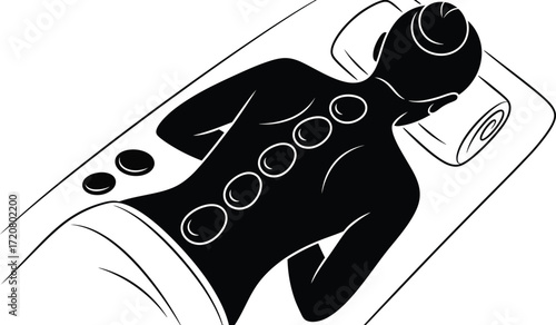 Person relaxing with hot stones on their back during a soothing spa treatment.