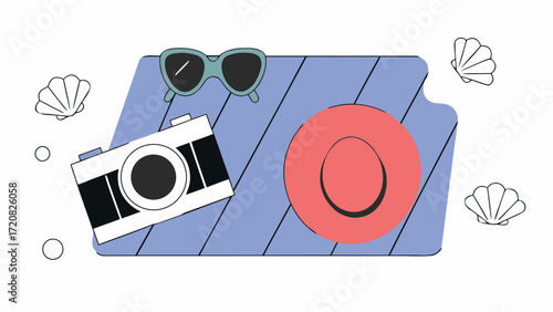 Top view of camera, hat, and sunglasses on beach towel with seashells, evoking summer vacation vibes