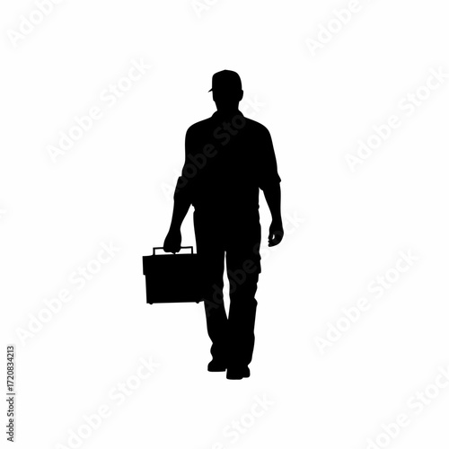 Silhouette of a technician carrying a toolbox towards a server room