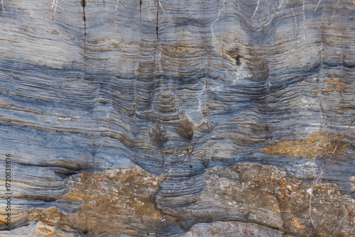 The rock layer broke in the cliff.