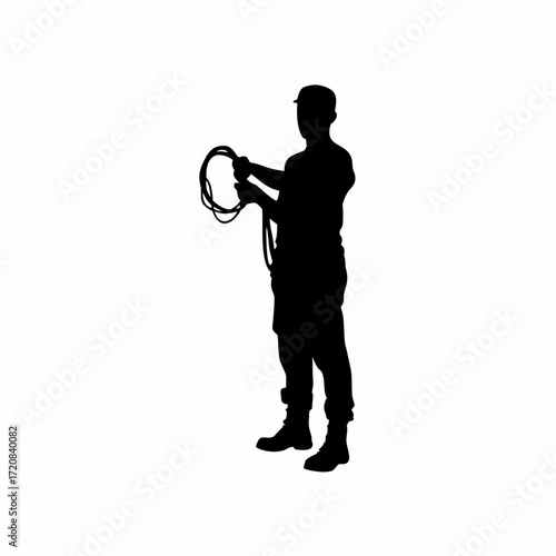 Silhouette of technician holding a lan cable and testing connection