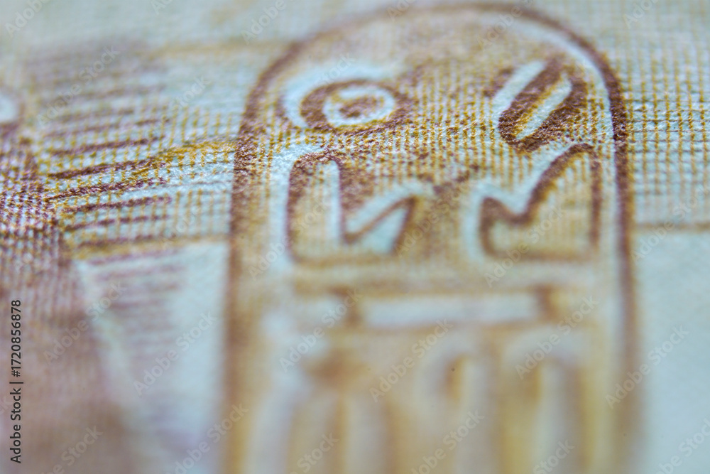Naklejka premium Close-Up of Ancient Egyptian Hieroglyphs on Papyrus Material